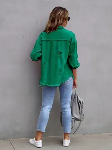 Back detail of a vibrant green oversized distressed denim jacket for women