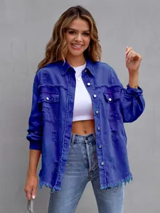 Detail view of women's blue distressed oversized denim jacket with frayed edges