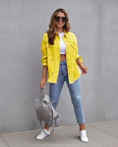 Stylish distressed yellow denim jacket for women shown in a full-length outdoor shot
