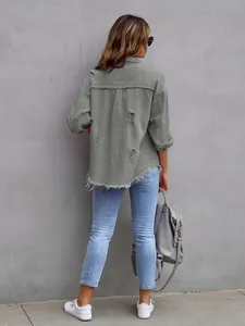 Back view of women's oversized olive green distressed denim jacket with frayed hem