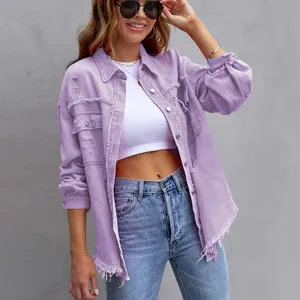 Oversized lavender distressed denim jacket for women with long sleeves and raw hem detail.