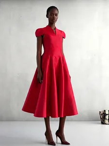 Elegant red V-neck party dress featuring petal sleeves and a pleated flare skirt
