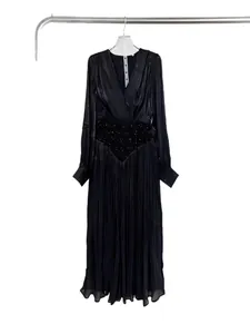 Elegant black V-neck pleated maxi dress with sequined waist and long mesh sleeves