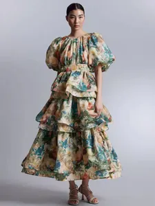 French vintage floral print tiered puff sleeve high waist cake dress worn by a model