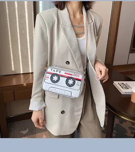 Detailed view of the vintage cassette tape shaped white PU crossbody bag with chain strap