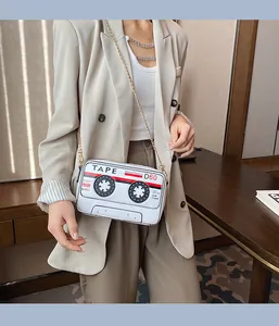 Creative cassette tape shaped PU leather crossbody bag with gold chain strap on model