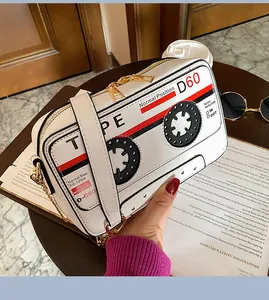 Retro cassette tape shaped crossbody bag in white PU leather with elegant gold chain strap