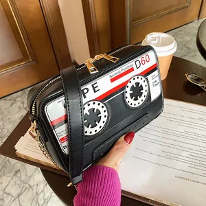 Detailed macro view of the creative retro cassette tape design on the black PU bag