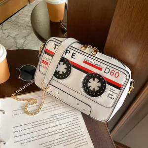 Retro cassette tape shaped crossbody bag with gold-tone chain strap and PU leather
