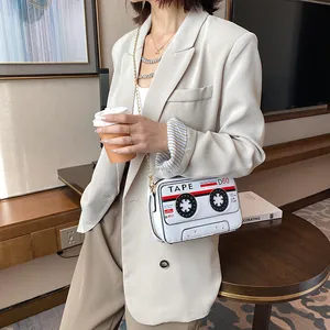 Creative white PU leather crossbody bag designed as a vintage cassette tape with chain
