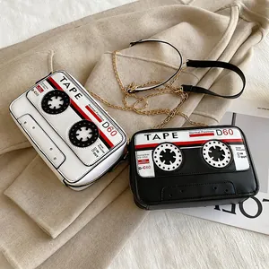Creative retro cassette tape shaped crossbody bag with gold chain strap in black and white