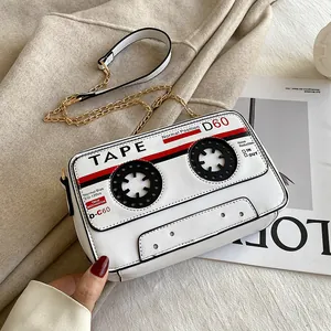 Close-up detail of a creative vintage cassette tape shaped PU leather crossbody bag