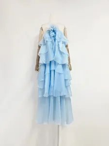 Full view of light blue tiered ruffled maxi dress with 3D flower detail on mannequin