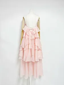 Back view of pink French style maxi dress with tiered ruffles and lace-up detail