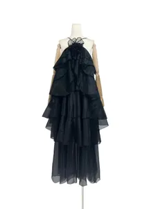 Elegant black French style tiered ruffle maxi dress featuring a 3D floral accent detail