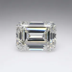 Macro detail of a clear emerald cut moissanite stone displaying vibrant rainbow dispersion