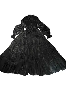 Elegant black pleated long-sleeve maxi dress with shirt collar and puff sleeves.