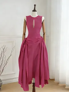 Elegant fuchsia sleeveless maxi dress featuring a chest cutout and pleated irregular hem design.