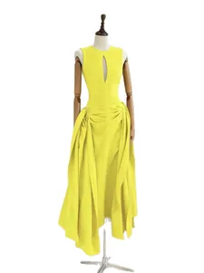Elegant yellow sleeveless dress with keyhole cutout and pleated asymmetric hemline.