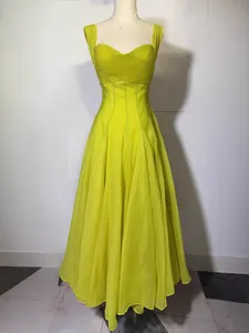 Elegant lime green pleated maxi dress with slim fit design for Spring 2026 fashion