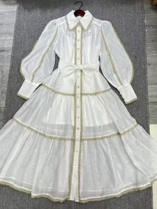 Elegant white French vintage lace dress featuring lantern sleeves and a button-front detail.