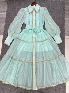Elegant mint green vintage lace dress featuring lantern sleeves and a tiered maxi skirt
