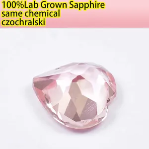 Macro view of a heart-shaped lab-grown pink sapphire gemstone with precise cut facets