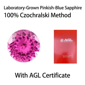 Macro view of lab-grown pink sapphire gemstone with AGL certificate cover details