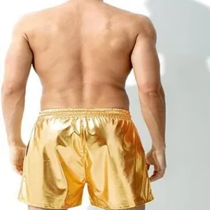 Back view of men's shiny metallic gold faux leather shorts featuring elastic waistband