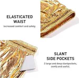 Detailed view of gold shiny shorts featuring elasticated waist and large slant pockets