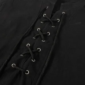 Detailed close-up of medieval retro black vest with adjustable lace-up front design