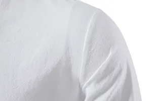 Close-up of white cotton linen shirt showing detailed fabric texture and shoulder seam