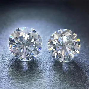Close-up macro view of two 8CT 13mm round brilliant cut moissanite stones with fire.