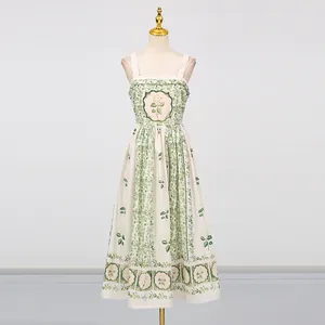Elegant Mori-style midi dress with green floral prints and cinched waist on mannequin