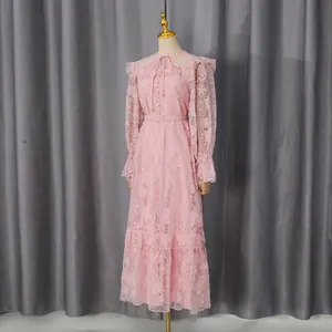 Elegant pink lace maxi dress featuring lantern sleeves and delicate floral embroidery
