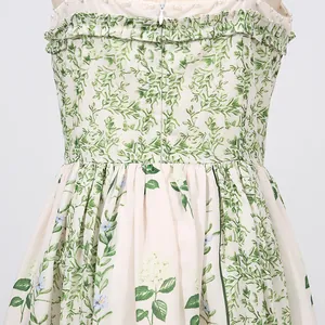 Detailed macro view of forest style floral print dress featuring back zipper and ruffles
