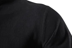 Detailed macro view of black cotton linen fabric texture on a men's shirt shoulder