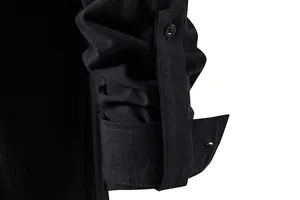 Close-up of black cotton linen shirt sleeve with button tab detail