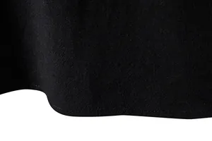 Macro shot of black cotton-linen fabric texture and precision hem stitching detail.