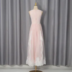 Back view detail of pink lace mesh maxi dress with white floral embroidery hem