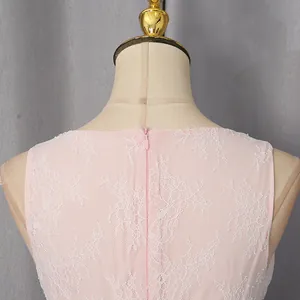 Close-up view of a pink lace dress back with invisible zipper and embroidery