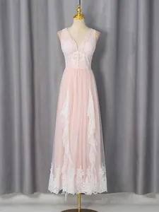Elegant light pink sleeveless maxi dress with exquisite white lace trim and V-neckline details