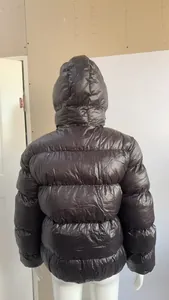 Detailed back view of a glossy dark brown winter hooded puffer jacket for men and women