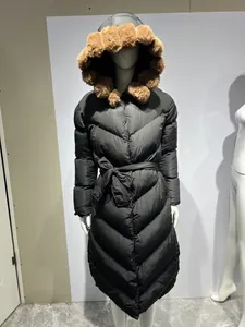 Long black hooded winter coat with large brown faux fur collar and belted waist detail