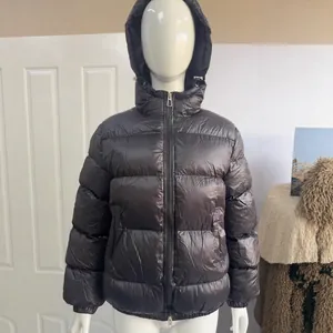 Warm unisex glossy black hooded puffer jacket with quilted design for winter outdoor wear