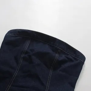 Close-up of a dark blue denim tube top featuring contrast yellow stitching detail