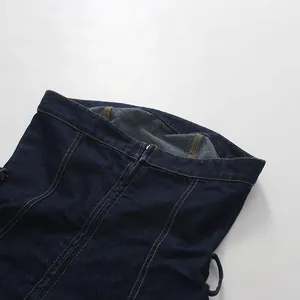 Close-up of dark blue denim tube top showing stitching and front zipper detail