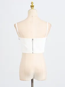 Elegant white slim fit crop top with back zipper and spaghetti straps on a mannequin