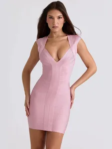 Frontal view of an elegant pink ribbed bandage bodycon dress featuring a deep v-neckline