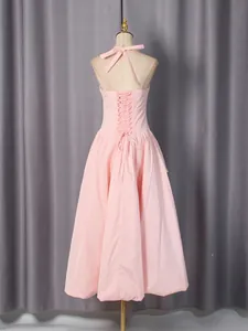 Elegant pink halter neck bandeau long dress with vintage corset-style lace-up back